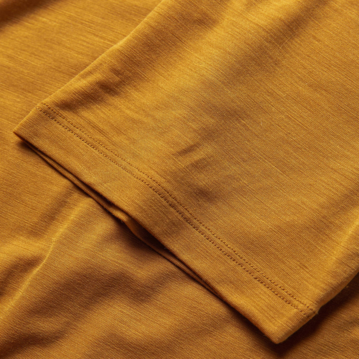 The Merino Tee in Heather Saffron
